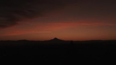 Sunrise timelapse in the Pacific Northwest as sun rises over Mt Hood in Oregon, night to day.