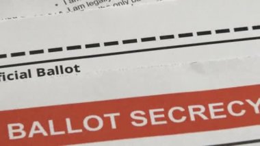 Rack focus zoom out on official ballot ready to send.