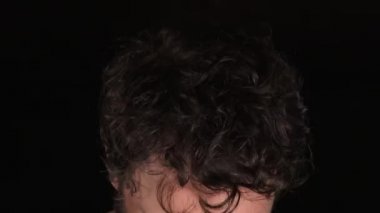 Man looks up at viewer and reveals he is a flesh eater!