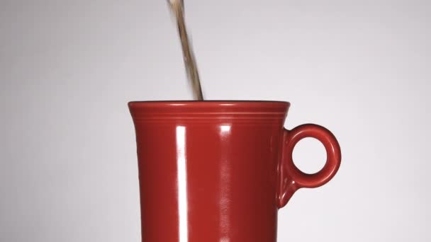 Simple Red Coffee Mug Gets Filled Coffee Studio White Background — Stockvideo