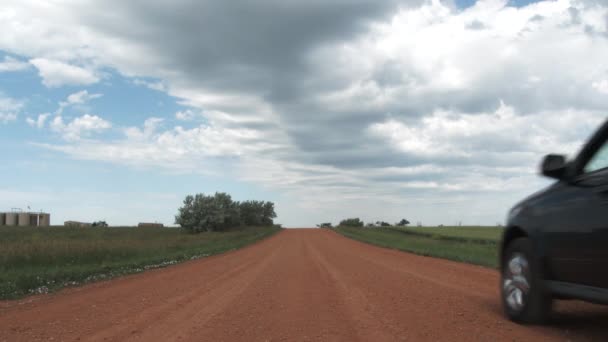 Sports Utility Vehicle Driving Red Colored Dirt Road Rural Country — Stockvideo