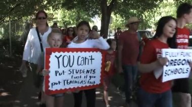 People marching downtown to the State Capitol to show their support for better education and smaller class sizes.