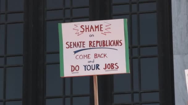 Person Holding Sign Reading Shame Senate Republicans Come Back Your — Stok video