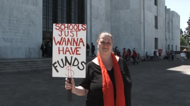 Teacher Standing State Capitol Building Holds Sign Reading Schools Just — Stockvideo