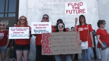 Group of teachers at State Building showing concern for Oregon schools and asking for more funding.