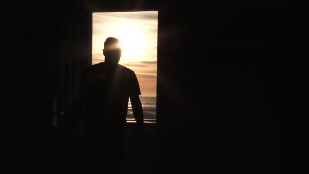 Person Opens Door Stands Doorway Watch Sunset Ocean Transition Black — Stock Video