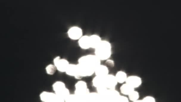 Ballen Van Licht Glinsteren Flikkeren Effect Tegen Zwarte Achtergrond — Stockvideo