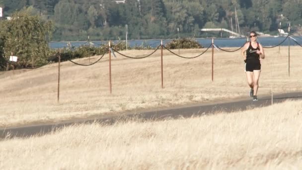 Woman Running Bicyclist Passing Her Hot Summer Day — Stock Video