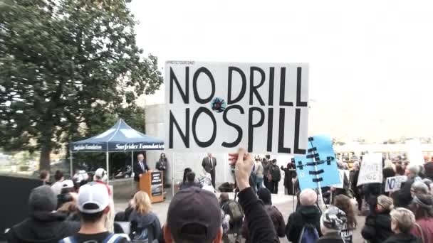 Person Holding Sign Reading Drill Spill Rally Big Oil Offshore — Stock Video