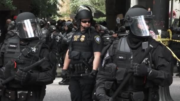 Several Police Officers Patrol Streets Riot Gear Heavily Armed Organized — Stock Video