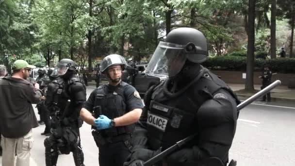 Several Police Officers Riot Gear Including Large Force Driving Street — Stock Video