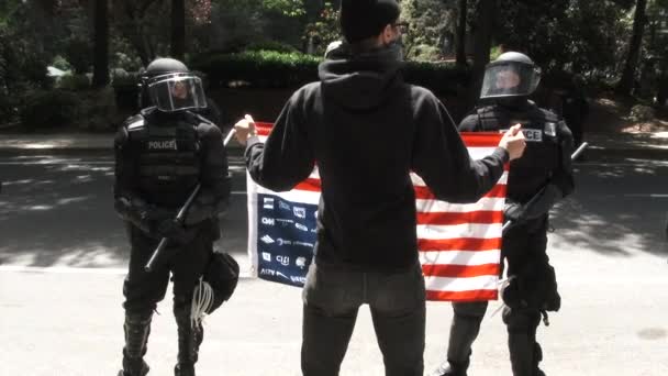 Person Holding American Flag Lifts Air Upside Front Police Protest — Stock Video