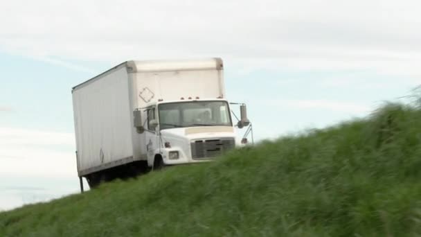 Cargo Truck Driving Grassy Hillside Road — Stock Video