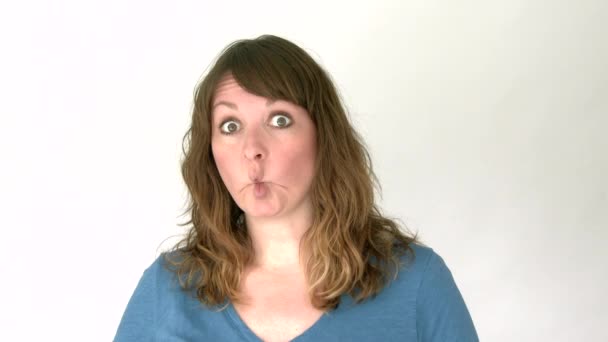 Model released woman isolated on white sticking out her tongue and making a fish face. — Stock Footage Model Released Woman Isolated White Sticking Out Her Tongue Making Video Clip
