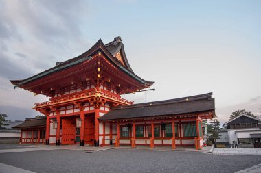 Pagoda at the entrance of Fushimi Inari Shrine or Fushimi Inari Taisha, a Shinto shrine. A Japanese monument, famous for its thousands of vermilion torii gates.  clipart