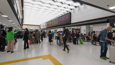 TOKYO, JAPAN - CIRCA MARCH, 2017: Passengers inside Narita airport. Narita International Airport is an international airport located 60 kilometres east of central Tokyo in Chiba Prefecture.  clipart