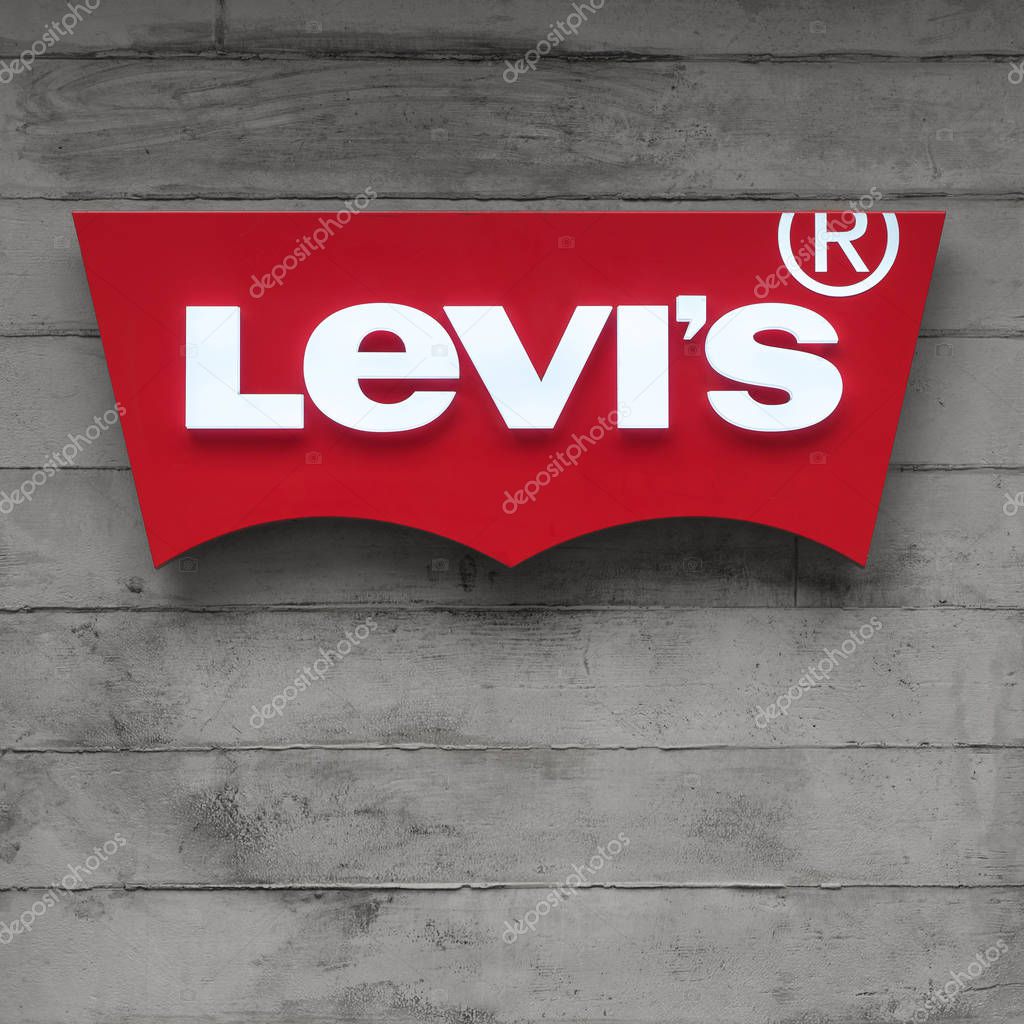 TOKYO, JAPAN - CIRCA MARCH, 2017: Levi's logo with concrete background. Levi Strauss & Co. is an American clothing company known worldwide for its brand of denim jeans. It was founded in May 1853.