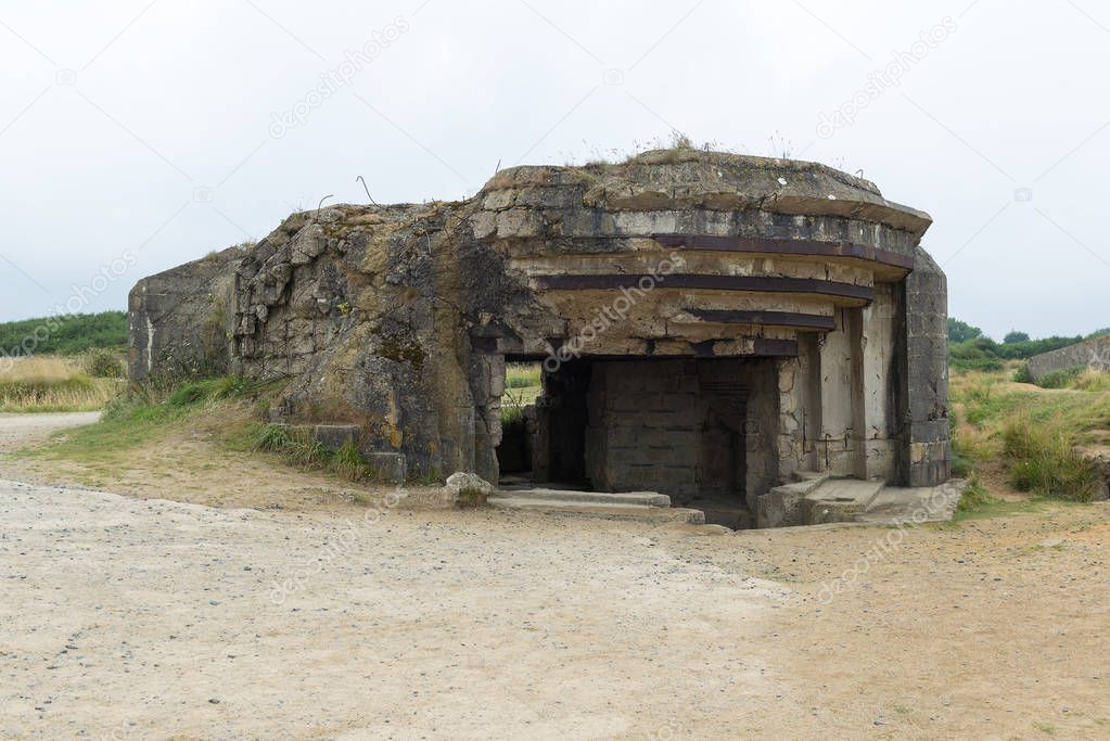German bunker from the Second World War by Omaha beach. Omaha beach is located on the coast of Normandy, France, facing the English Channel, and is 5 miles (8 km) long. 