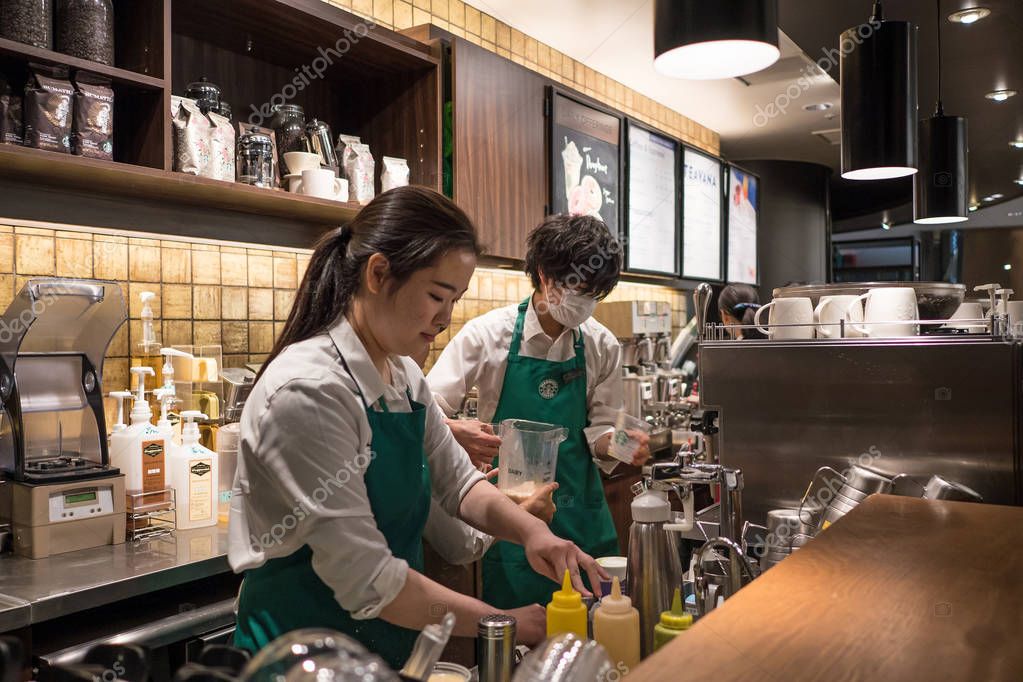 TOKYO, JAPAN - CIRCA MARCH, 2017: Drink preparation inside Starbucks coffee. Starbucks is the largest coffeehouse company in the world.