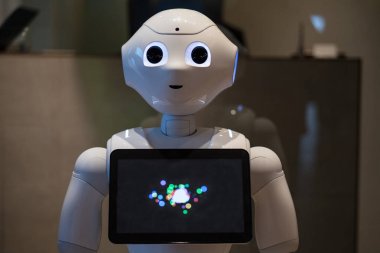 TOKYO, JAPAN - CIRCA MARCH, 2017: Pepper robot. Pepper is a humanoid robot by Aldebaran Robotics and SoftBank designed with the ability to read emotions. clipart