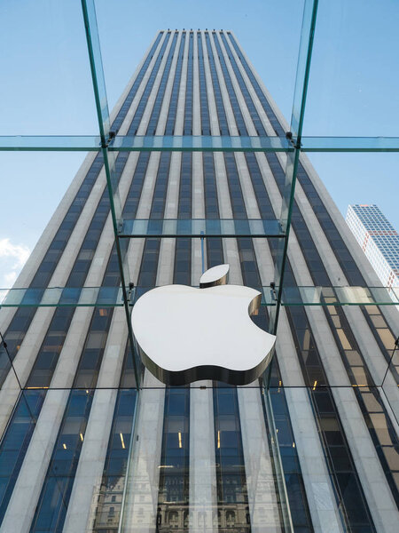 NEW YORK - MAY 13, 2015: Apple logo at the entrance of 5th Avenue store in Manhattan. As of 2014, Apple employs 72,800 permanent full-time employees, maintains 437 retail stores in fifteen countries. 