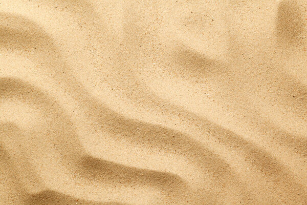 Природный морской песок для летнего фона. Вид сверху. Плоский лежал
