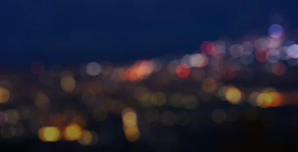 Colorido desfocado bokeh luzes no borrão noite fundo — Fotografia de Stock