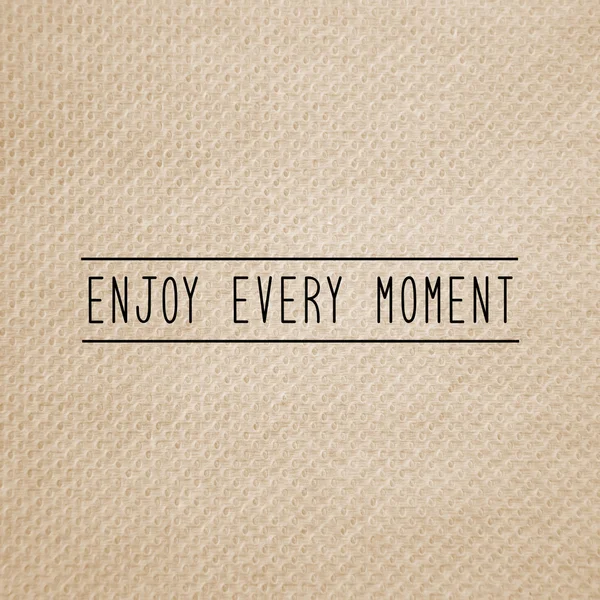 Enjoy every moment on brown tissue paper — ストック写真