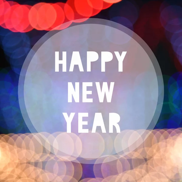 Feliz ano novo em fundo bokeh colorido — Fotografia de Stock