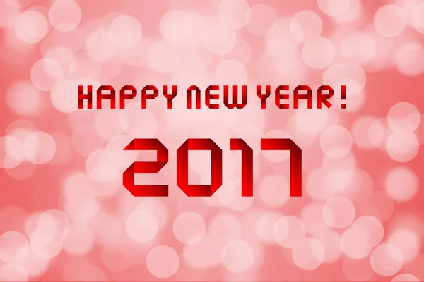 Happy new year 2017 on red bokeh background — Stock Photo, Image