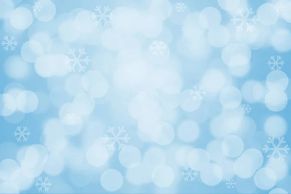 Snowflakes and bokeh light on blue background — Stock Photo, Image