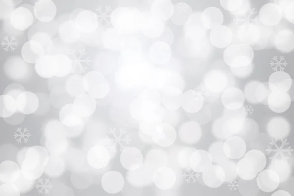 Snowflakes and bokeh light on gray background — Stock Photo, Image