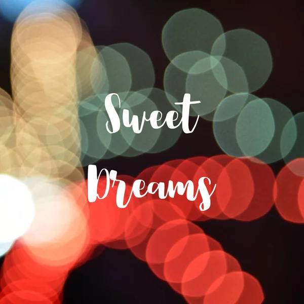 Όνειρα γλυκά κείμενο σε πολύχρωμο bokeh φόντο — Φωτογραφία Αρχείου