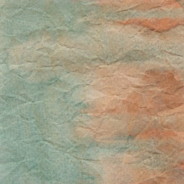 Yeşil ve turuncu buruşuk kağıt arka planı için