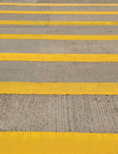 Yellow crosswalk on the road