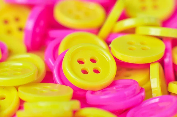 Yellow and pink buttons (clasper) — Stock Photo, Image