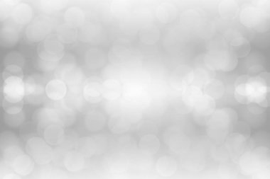Gri arka plan üzerinde beyaz bokeh ışıklar