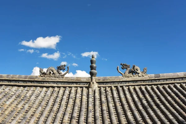 Traditional stone dragon decoration on the roof