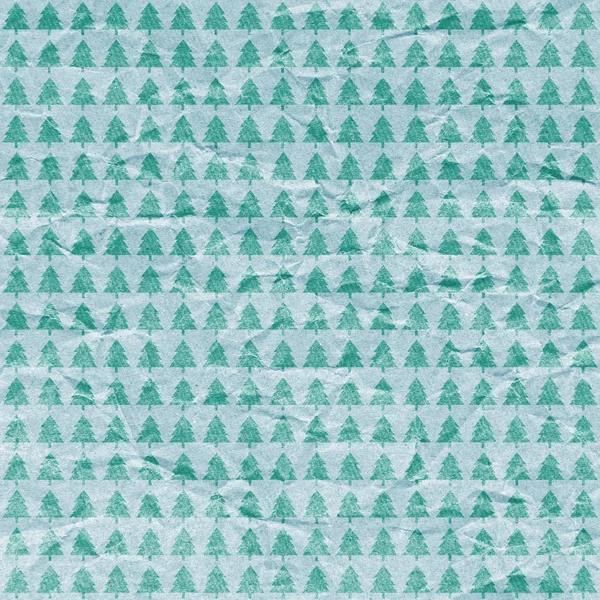 Christmas trees pattern on crumpled paper background. — Stock Photo, Image