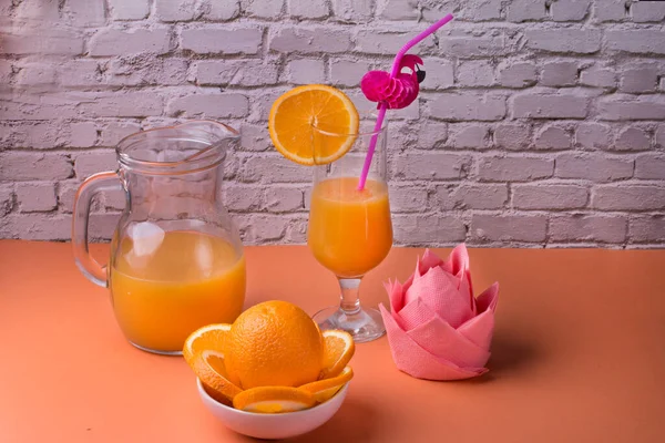 Citrus orange drink in a carafe. Orange cocktail.