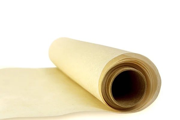 Rollo de papel de hornear pergamino aislado sobre un fondo blanco. Vista lateral . — Foto de Stock