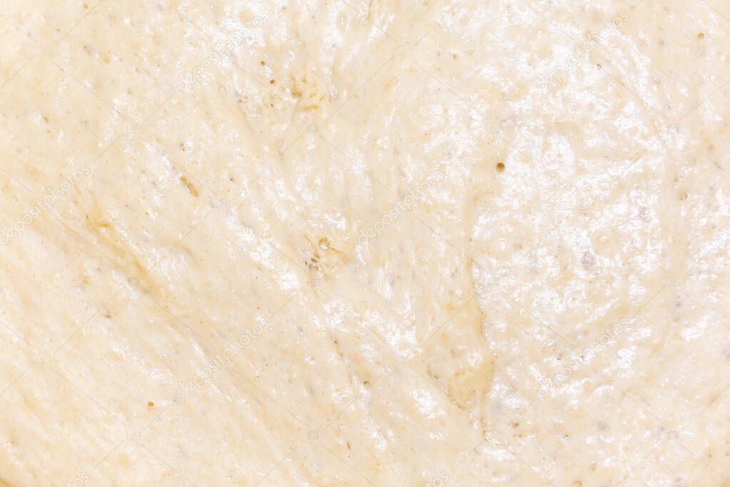 Dough for baking closeup. Abstract culinary background.