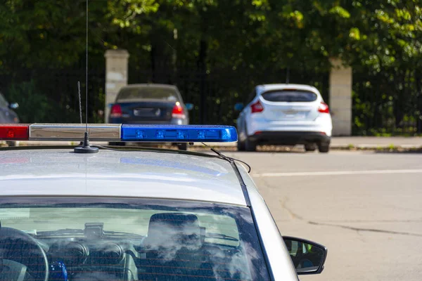 Police car in the afternoon in the city with selective focus and — Stock Photo, Image