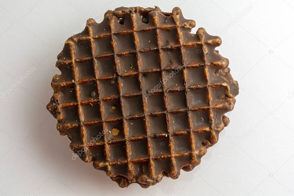 Belgian round waffles with chocolate. Topping on a light background. Dessert concept. View from above.