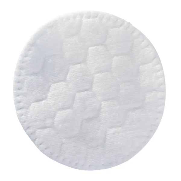 Almofada de algodão cosmético isolado em um fundo branco. Um travesseiro cosmético de algodão redondo em branco . — Fotografia de Stock