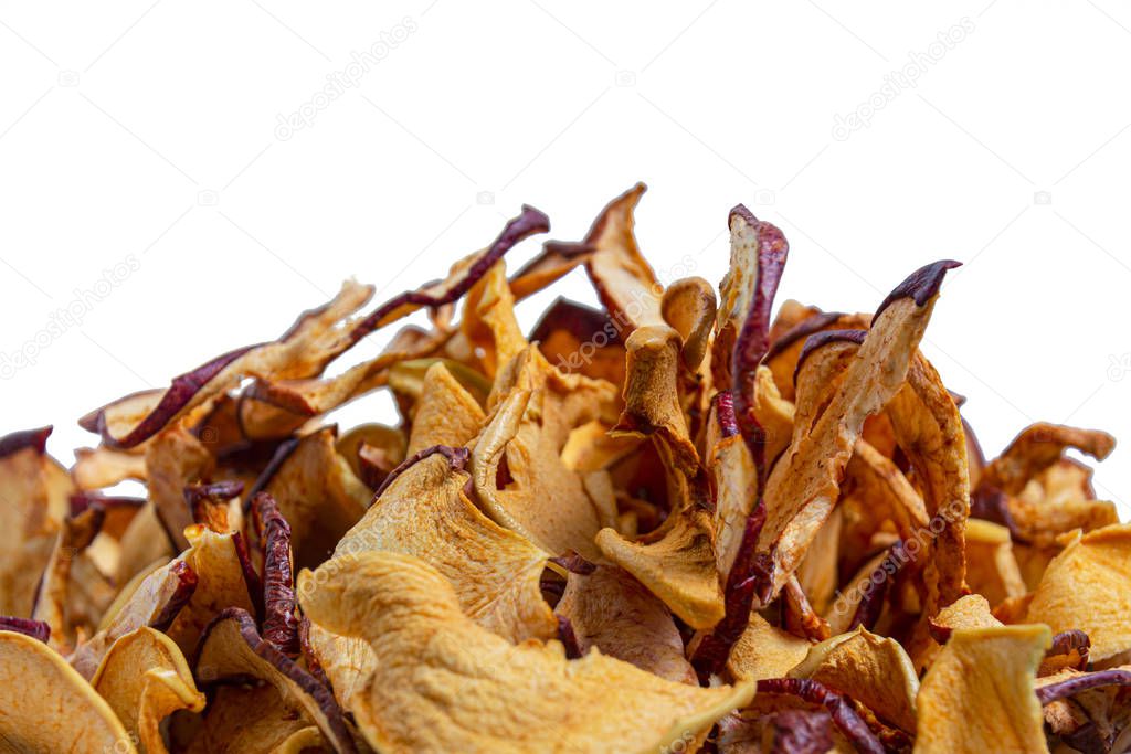 A pile of dried apples isolated on a white background. Concept: harvesting and storage of fruits, healthy nutrition, vitamins.