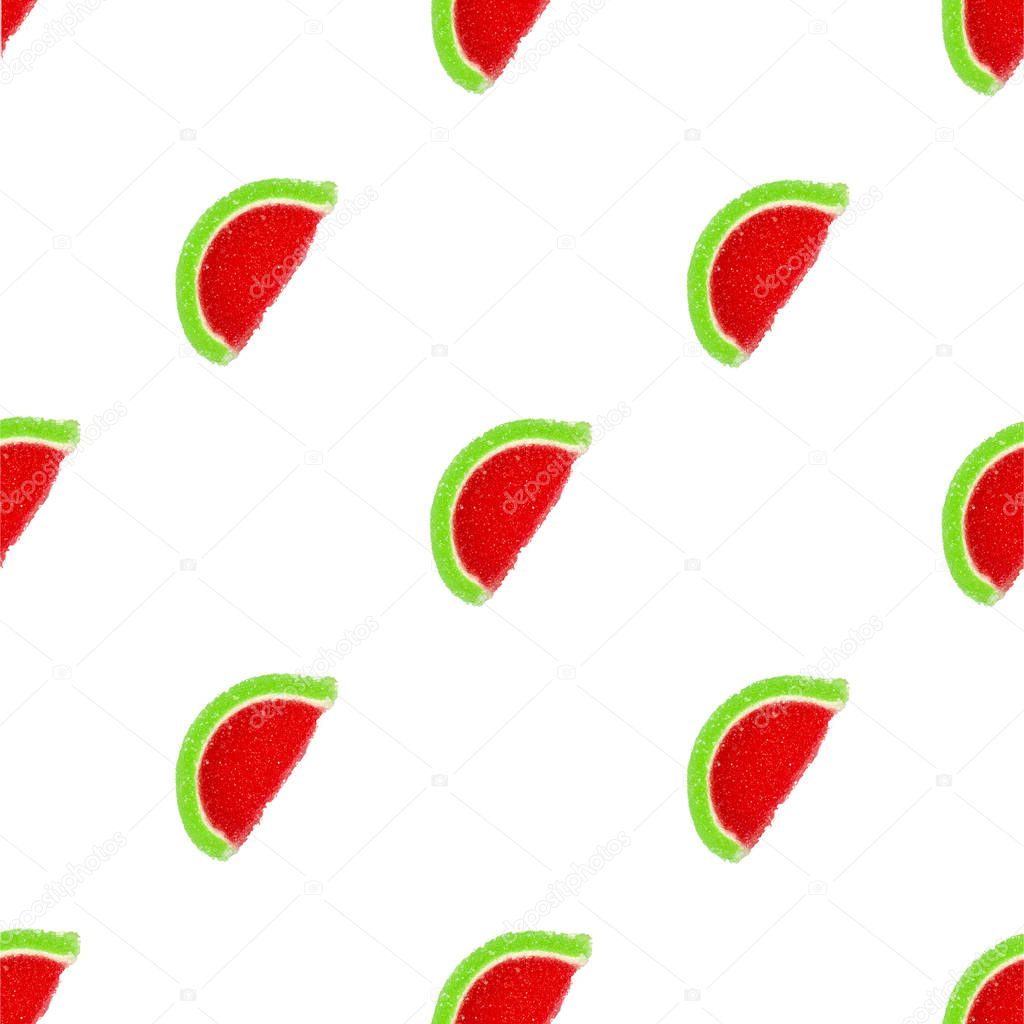 Slices of marmalade in the shape of a watermelon isolated on a white background. Seamless background
