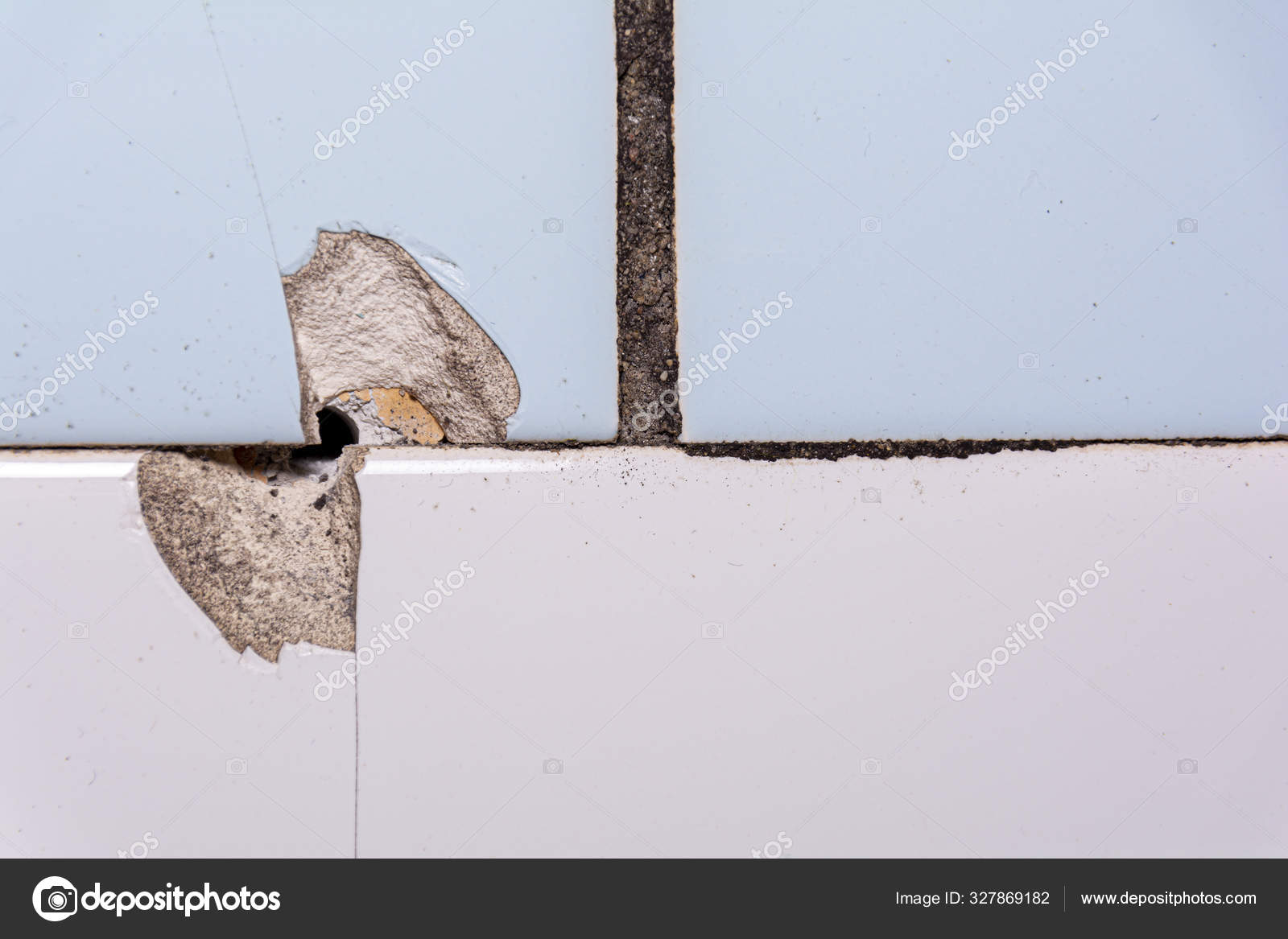 Old ceramic tiles, defective installation, poor repair. Chips and
