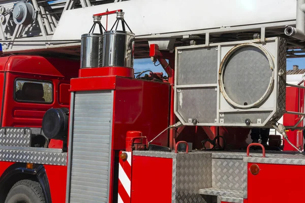 Fragment of a red fire engine. Fire technological transport. Fire engines are preparing for fire fighting. — Stock Photo, Image