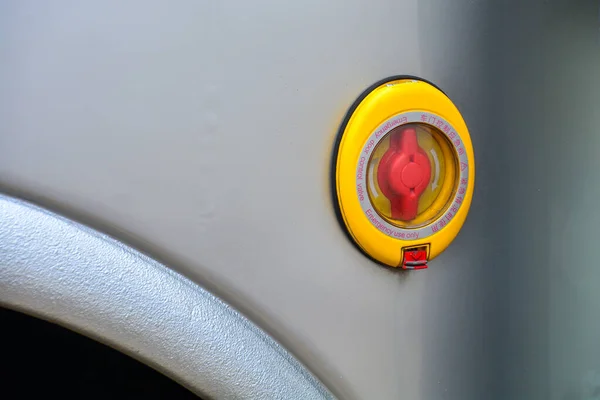 Emergency door control valve close-up on a bus. Safety concept, emergency prevention, operational assistance.